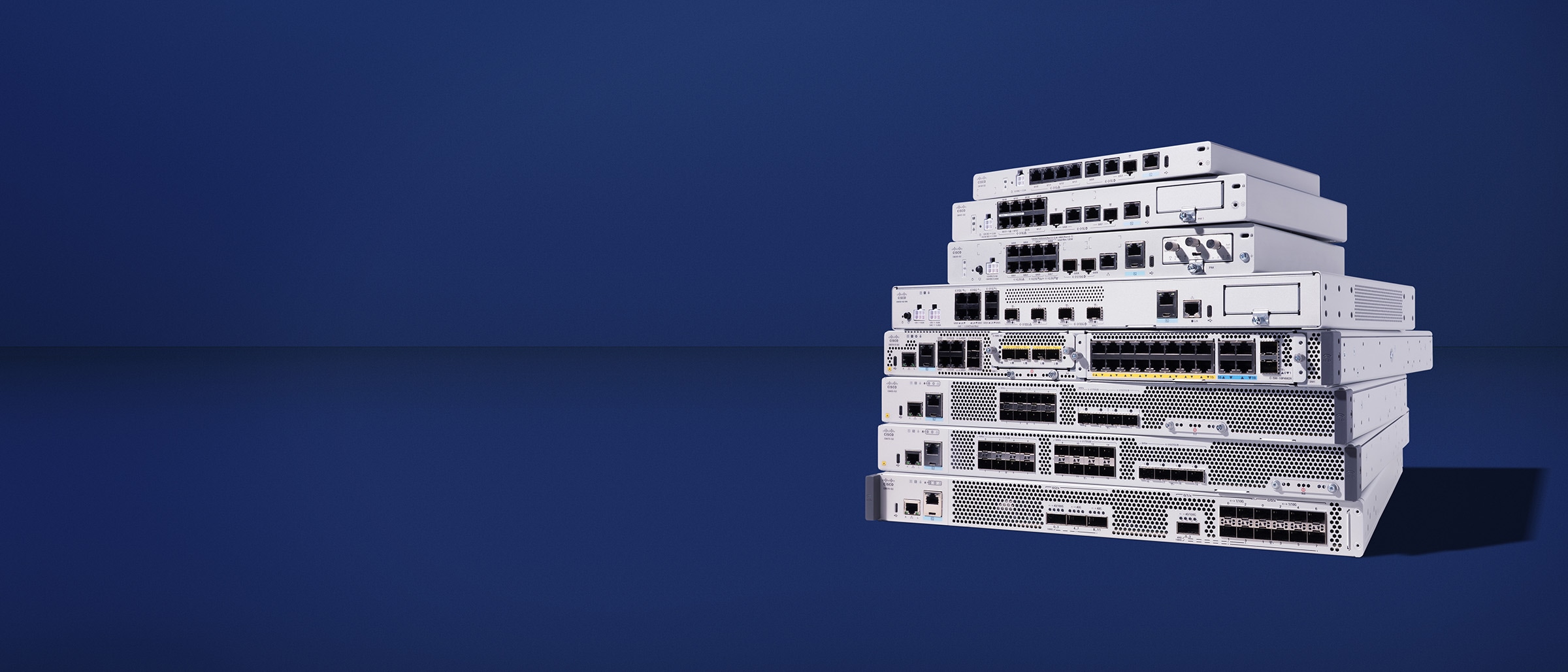 A stack of Cisco secure routers with various front-panel ports.
