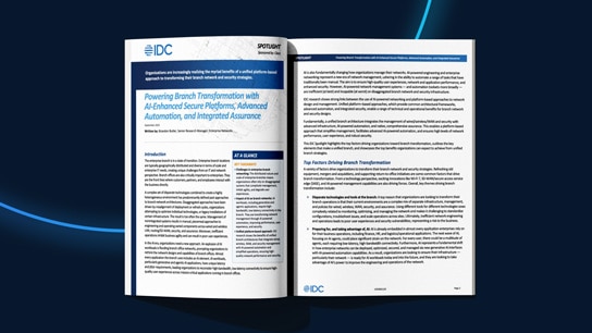 Two employes working at a desk on computers