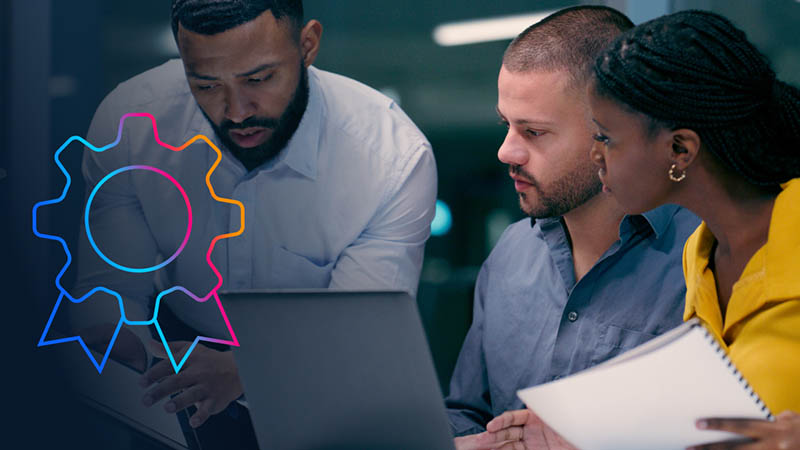 Three business professionals working together.