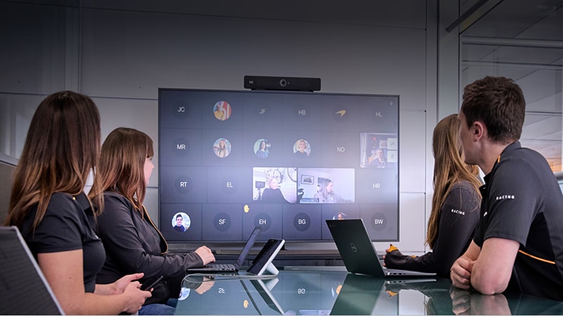 Cisco collaboration display showing multiple remote participants.