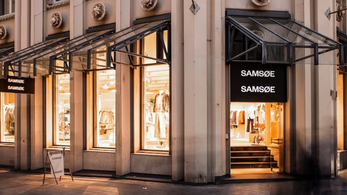 Samsøe Samsøe retail storefront with large display windows and signage reading SAMSØE SAMSØE.